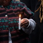 The transgender community gathers to mourn the death of Ashanti Carmon at a candelit vigil.