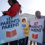 People supporting the right to opt-out their children from classes containing LGBTQ-related content demonstrate outside the Supreme Court.