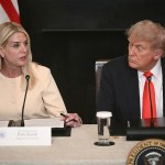 Pam Bondi, the attorney general, sits next to President Donald Trump.